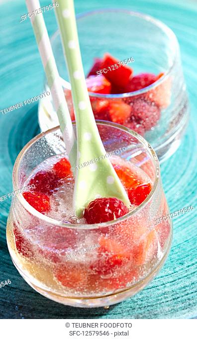 Non-alcoholic fruit punch with ginger ale, strawberries and raspberries