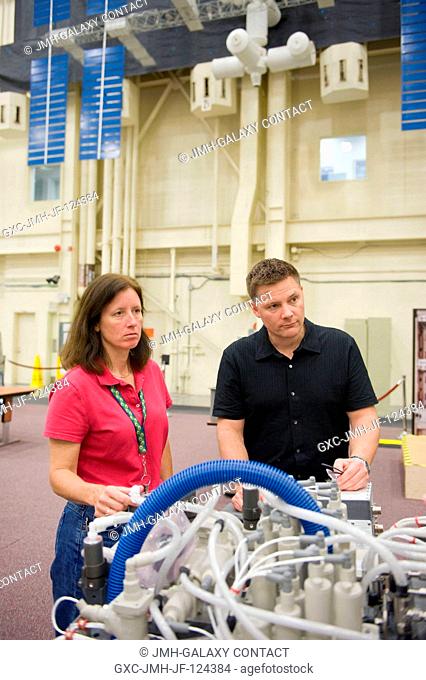 NASA astronauts Doug Wheelock, Expedition 24 flight engineer and Expedition 25 commander; and Shannon Walker, Expedition 2425 flight engineer