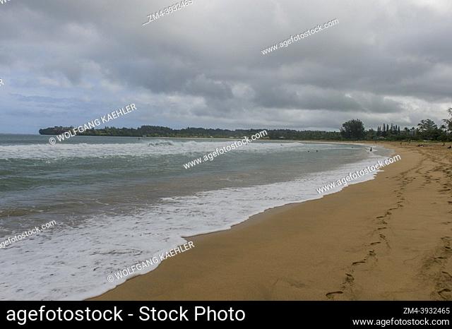 Dark rain clouds over Hanalei beach on the northern end of the Hawaiian Island of Kauai, Hawaii, USA