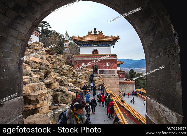 Tourists walks around Four Great Regions complex, mix of Tibetan and Chinese style temple on Longevity Hill in Yiheyuan, Summer Palace, Beijing, China