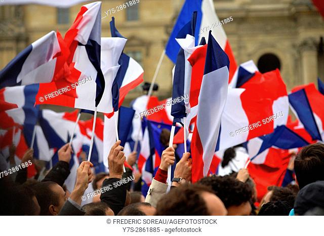 Macron supporters celebrate his victory outside the Louvre museum in Paris, France