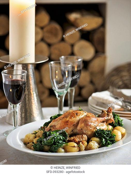 Roast chicken with potatoes and spinach