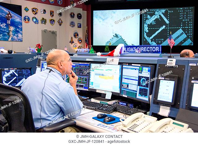 A scene inside the space station flight control room (FCR-1) in the Johnson Space Center's Mission Control Center features Flight Director Tony Ceccacci seated...