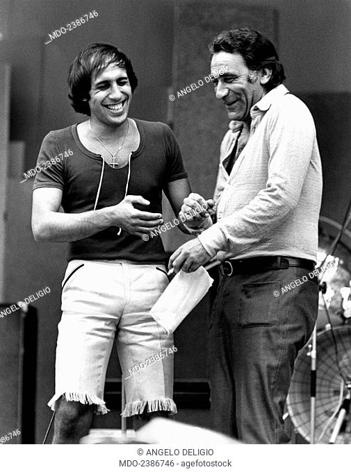 Italian singer-songwriter, dancer, actor and showman Adriano Celentano smiling with Italian actor and dubber Alberto Lupo (Alberto Zoboli) during Cantagiro...