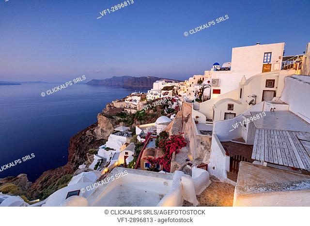 View of the Aegean Sea from the typical greek village of Oia at dusk Santorini Cyclades Greece Europe