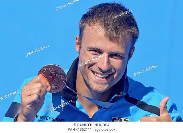 Bronze Medalist Sascha Klein of Germany celebrates after the men's 10m Platform diving final of the 15th FINA Swimming World Championships at Montjuic Municipal...