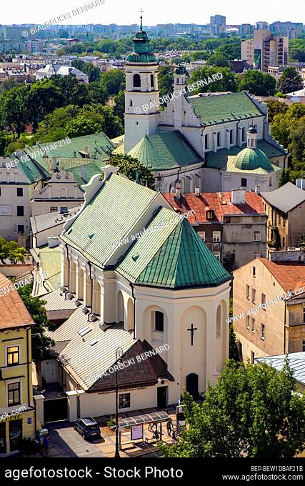 Lublin, Lubelskie / Poland - 2019/08/18: Panoramic view of historic old town quarter with St. Peter Apostle church and Conversion of St. Paul church