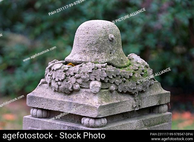 16 November 2023, Saxony, Leipzig: The sculpture of a German steel helmet from the First World War at the South Cemetery. On Volkstrauertag (19.11