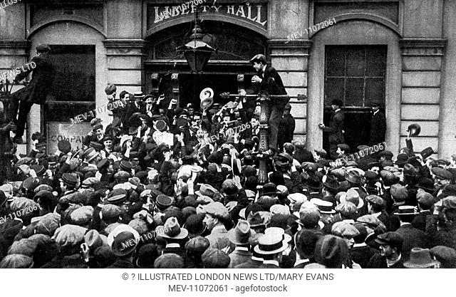 Tramwaymen strikers cheering outside Liberty Hall, Dublin, the headquarters of the Transport Workers Union, 1913
