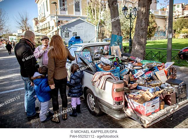 A street hawker sell flea market items from his pickup car in central Athens, Greece, 23 January 2015. Greece's leftist, anti-austerity Syriza party is poised...