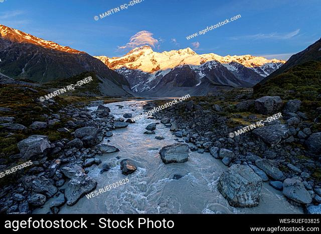 New Zealand, Canterbury Region, Hooker River at dawn with Mount¶ÿSefton¶ÿin background