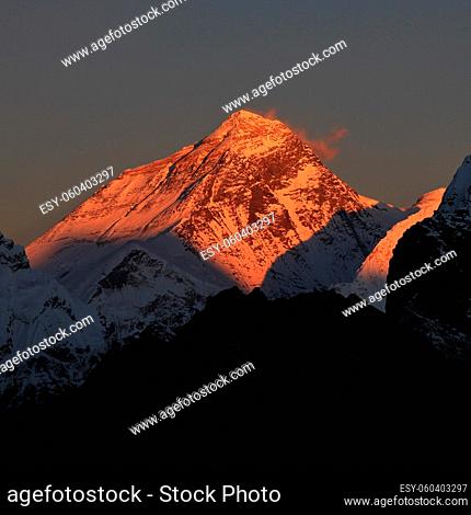Highest mountain of the world at sunset. Illuminated peak of Mt Everest