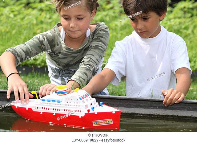 Children playing with boat