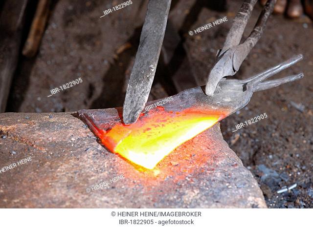 Red-hot scrap metal being forged, Babungo, Cameroon, Africa