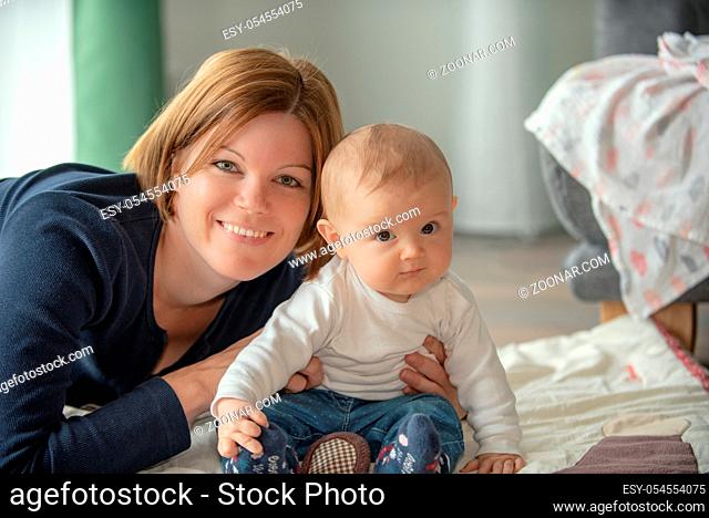 Portrait of young mother with young toddler