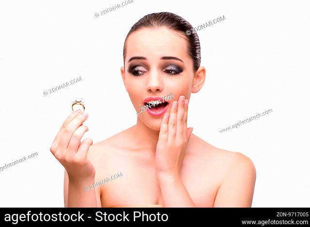 Young woman with engagement ring isolated on white