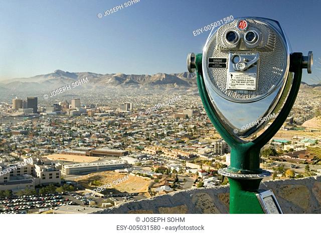 Long range binoculars for tourists and panoramic view of skyline and downtown of El Paso Texas looking toward Juarez, Mexico