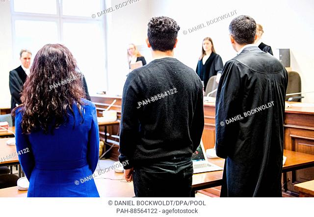 The accused Behzad S. (M) standing in the court next to his lawyer Shahryar Ebrahim-Nesbat (r) in Hamburg, Germany, 28 February 2017