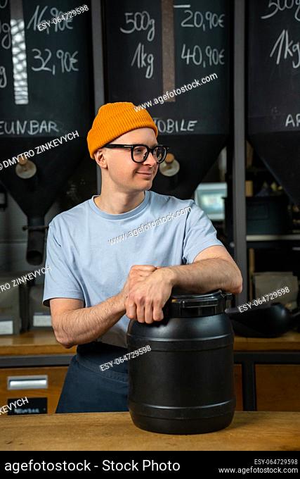 Barista in coffee shop preparing for working day waiting for customers