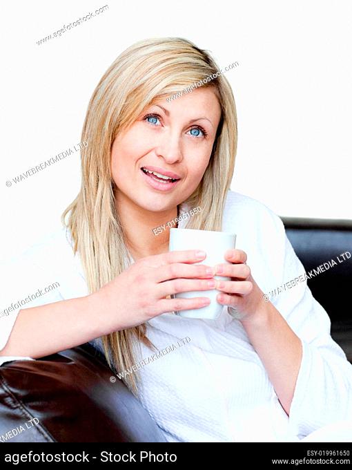 Cheerful woman holding a cup of coffee