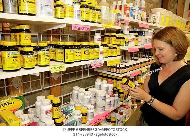 Arkansas, Eureka Springs, Fain's Herbacy, Serious Supplements and Herbals, woman, shopping, shelves, display, alternative, botanical medicine, healing