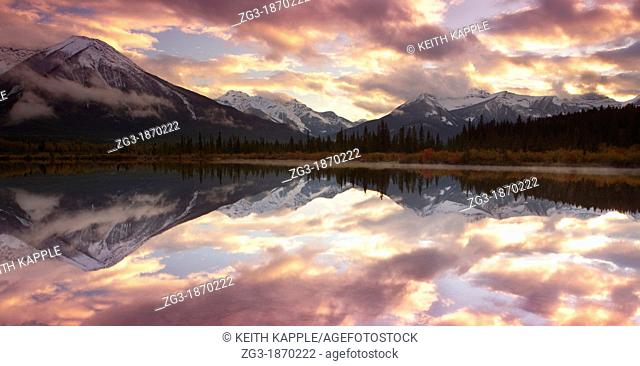Mountain Range Reflected on Still Lake during Sunset at the Vermillion Lakes, Banff, Canada
