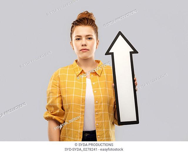 red haired teenage girl with arrow showing up