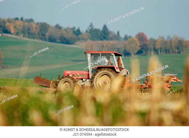 Tractor ploughing a field. Lower Bavaria. Germany