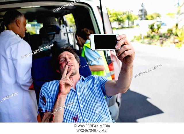 Injured man taking selfie