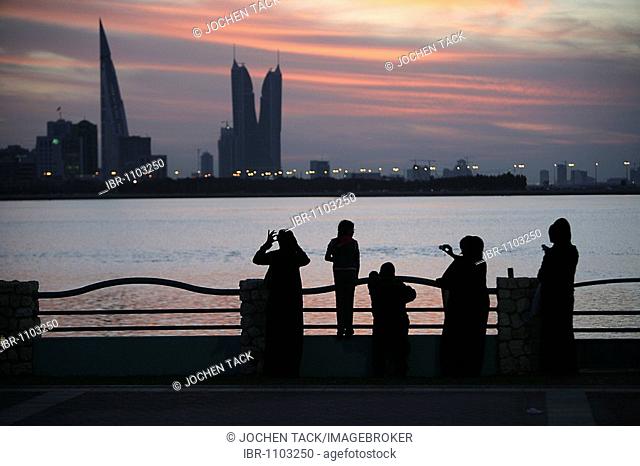 Skyline of the Corniche as seen from King Faisal Highway, Muharraq side, World Trade Center buildings, left, beside the towers of the Financial Harbour Complex