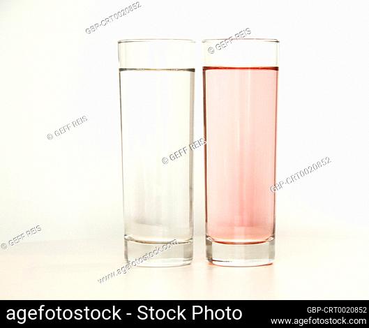 Two glasses of rose and transparent liquid on white background, São Paulo, Brazil