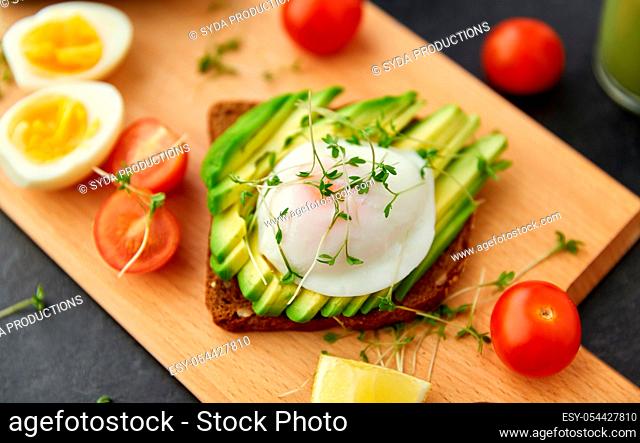 toast bread with avocado, eggs and cherry tomatoes