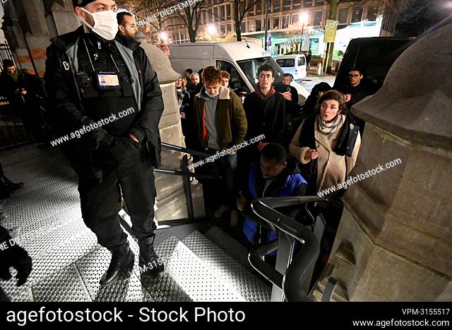 Illustration picture shows security at the entrance and protestors at the 'Eglise des Dominicains - Dominicanenkerk' in Brussels, Monday 13 December 2021