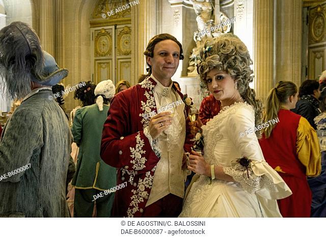 Courtship party (Fete galante) with participants wearing clothes from the Louis XIV period, Palace of Versailles, France. Historical reenactment