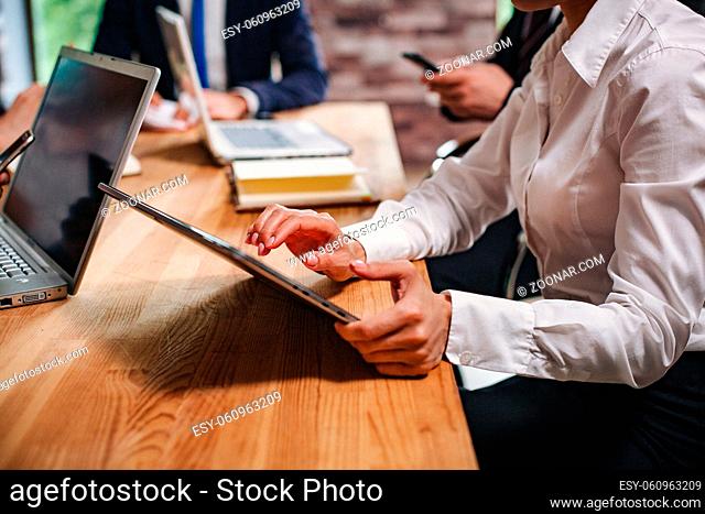 Group Of Young Business People Working In Office. Woman Holding Laptop. Selective Focus On Hands