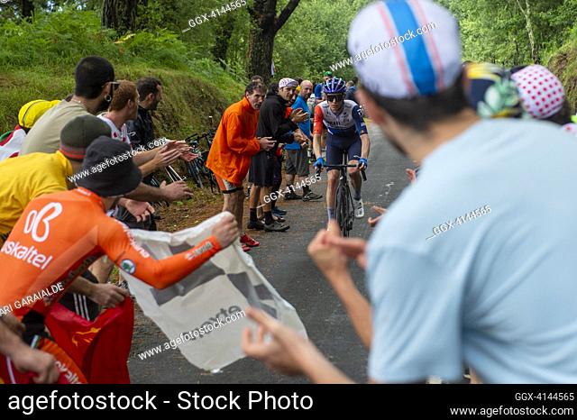 Ausralian rider Chris Harper of team Team Jayco-AlUla cycles in the final ascent of Jaizkibel mount pass while fans cheers during the stage two of the 110th...