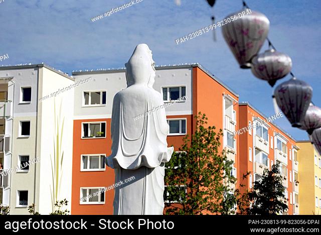 13 August 2023, Mecklenburg-Western Pomerania, Rostock: A large Buddha figure stands on the grounds of the Loc Uyen temple in Lichtenhagen