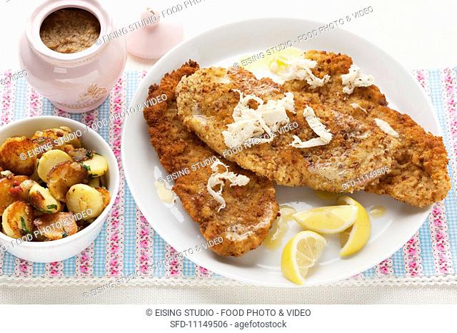 Wiener schnitzel (breaded veal escalope from Vienna) with horseradish and roast potatoes