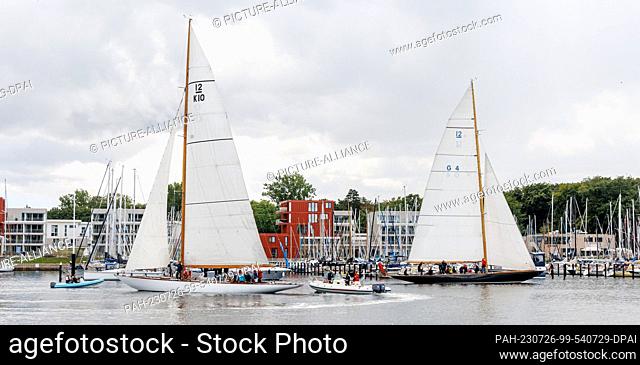 26 July 2023, Schleswig-Holstein, Lübeck-Travemünde: The 12-berth yachts Sphinx (l) and Trivia cruise the Trave River as they race for the Rotspon Cup