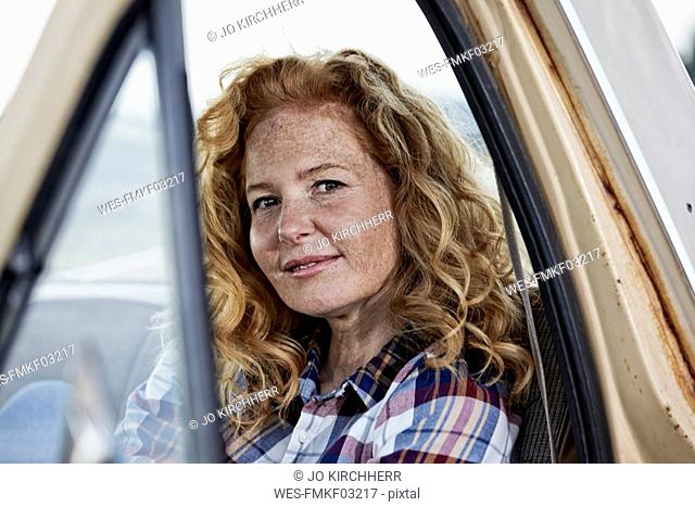 Portrait of woman in pick up truck