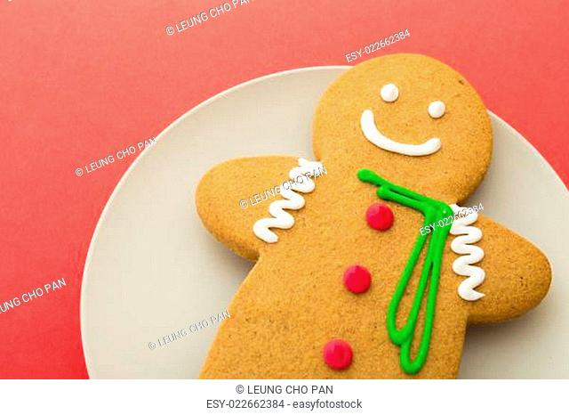 Gingerbread man on red background