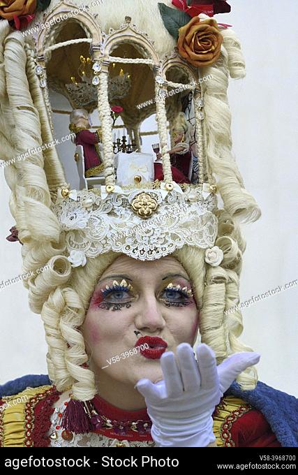 Italy, Unesco World Heritage Site, Venice carnival, Fancy headdress hosting a candllight dinner