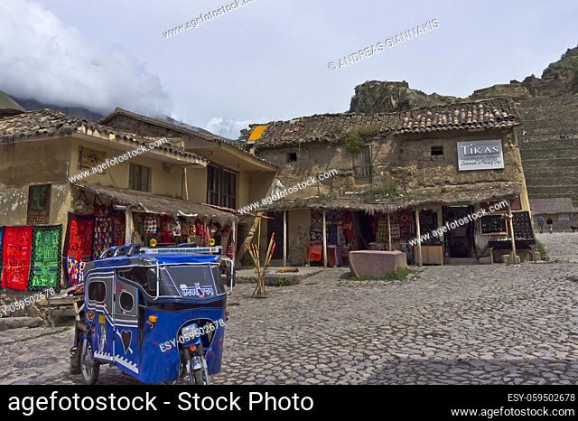 Sacred Valley, Ollantaytambo Ancient city view with traditional clothes shop, Peru, South America