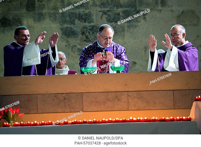 The Bishop Jean-Philippe Nault (C) holds a commemorative service in the Cathedral Notre-Dame-du-Bourg in Digne-les-Bains, France, 28 March 2015