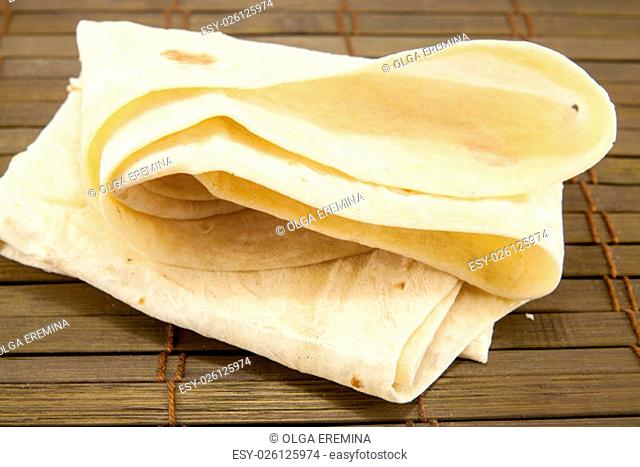 Large thin pita bread, isolated on a white background