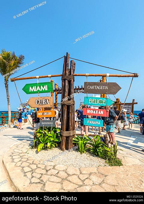 Costa Maya, Mexico - April 26, 2019: Arrow wooden authentic sign with Caribbean countries destinations at sea ocean harbour