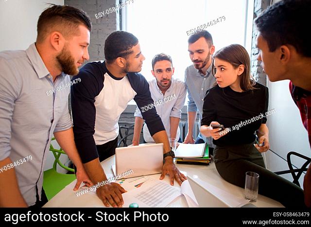 Business people having round table in office. Picture of many office workers working in board room all together. Business or freelance concept