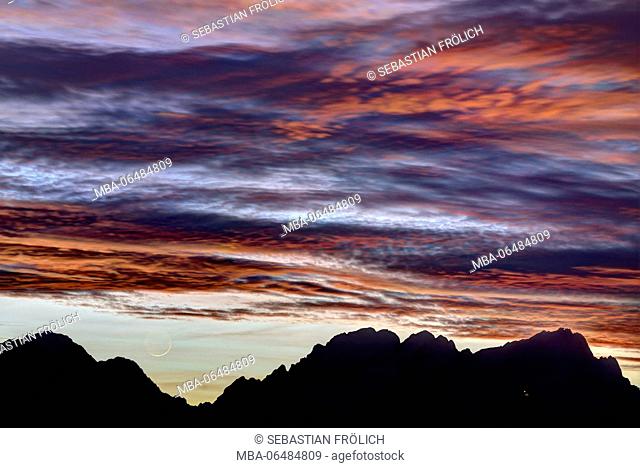 Spectacular afterglow with sickle moon over Wetterstein Range and the Zugspitze