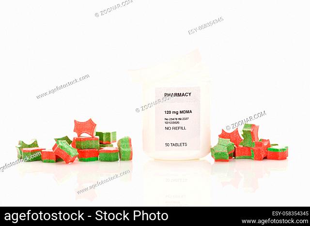 Ecstasy pills in perscription bottle isolated on white background. MDMA-Assisted Psychotherapy for PTSD