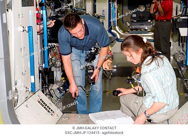 NASA astronauts Tracy Caldwell Dyson, Expedition 2324 flight engineer; and Doug Wheelock, Expedition 24 flight engineer and Expedition 25 commander